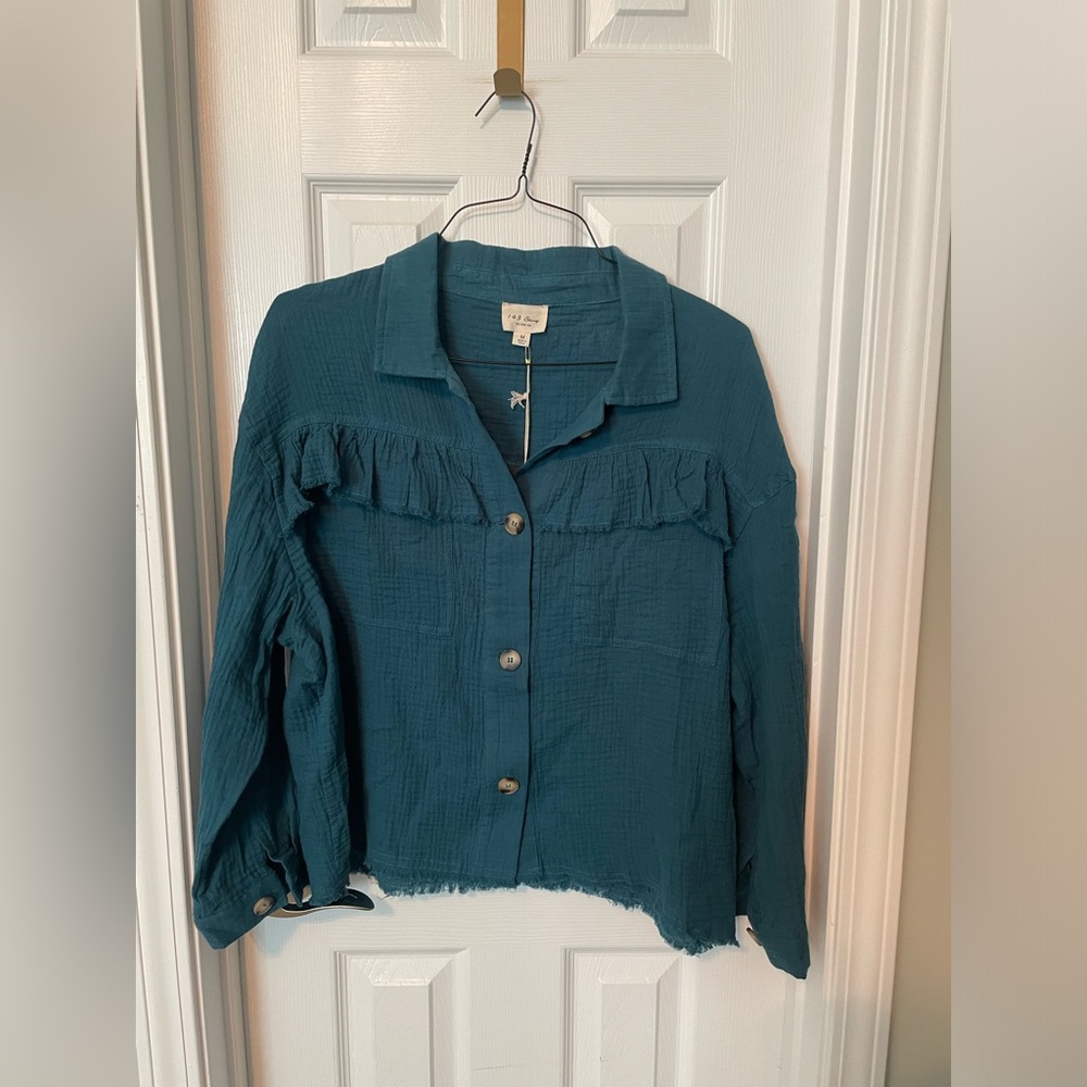 Boutique button down teal shirt.